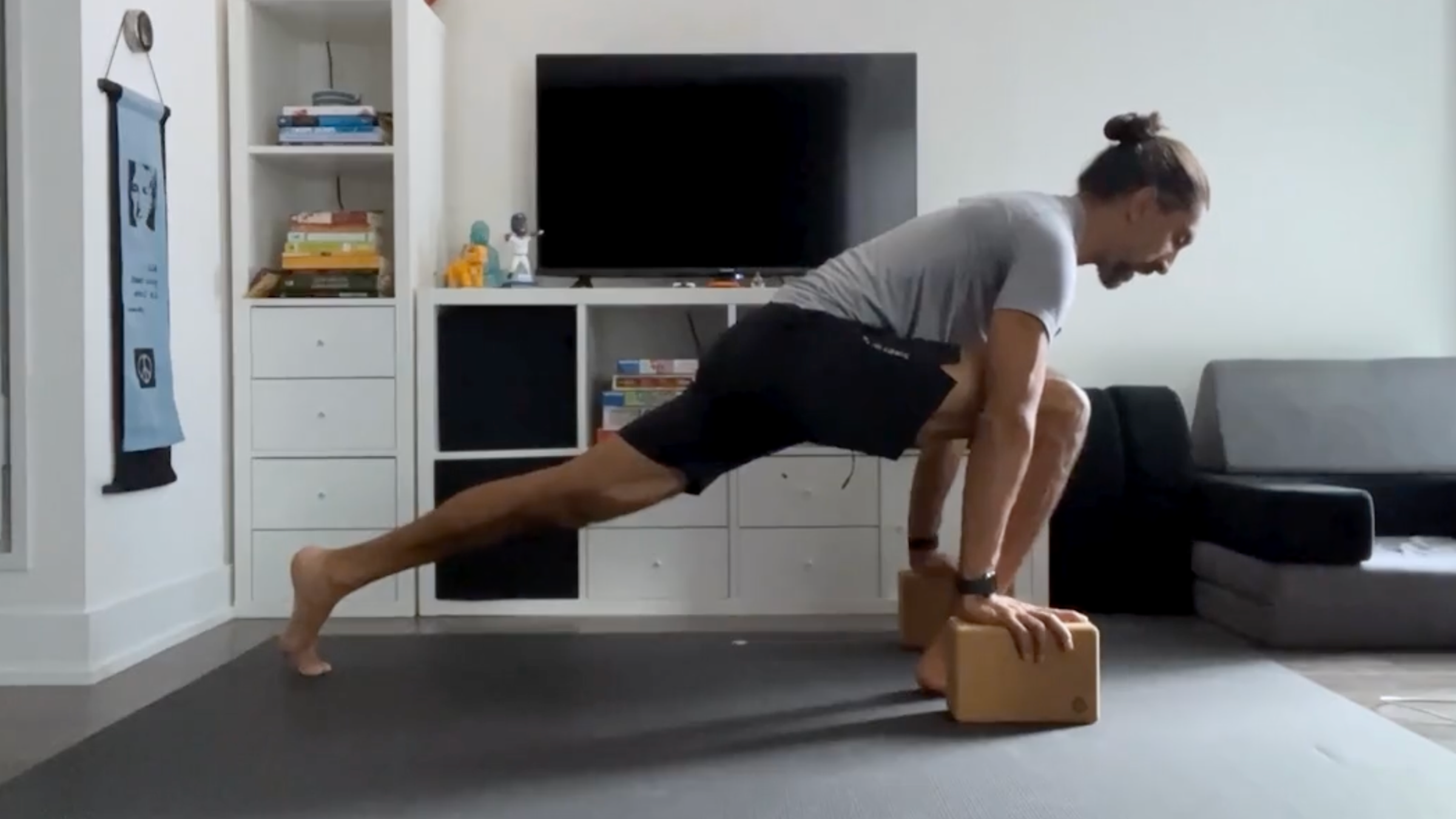 Yoga teacher Jaffer Hussain in Runner's Lunge, Utthita Ashwa Sanchalanasana in Sanskrit, one of his series of hips stretches